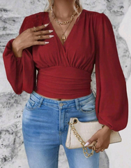 Blusa plisada con marcación de cintura